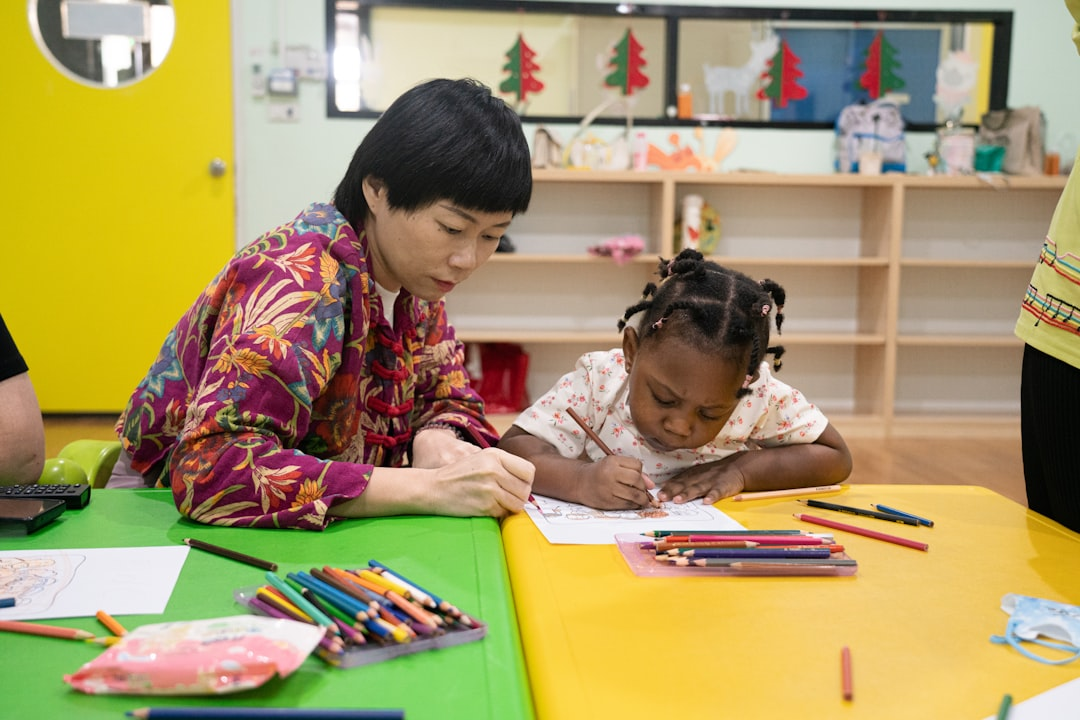 Adult and child learning together in a child care setting
